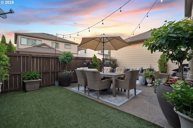 12339 SW Waterford Loop, Wilsonville, OR 97070 - patio terrace at dusk featuring a patio and outdoor dining space