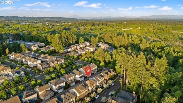 12339 SW Waterford Loop, Wilsonville, OR 97070 - aerial view of property's location featuring a heavily wooded area, nearby suburban area, and mountains