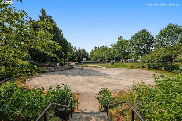 12339 SW Waterford Loop, Wilsonville, OR 97070 - view of patio / terrace with community basketball court and view of wooded area