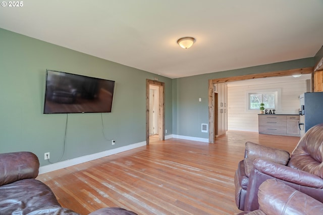 living room with light hardwood / wood-style floors