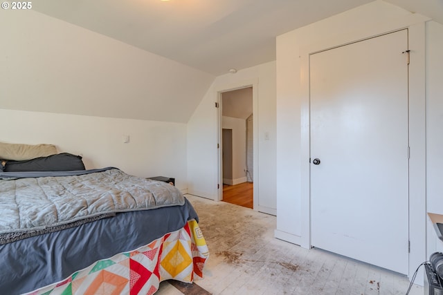 bedroom featuring vaulted ceiling