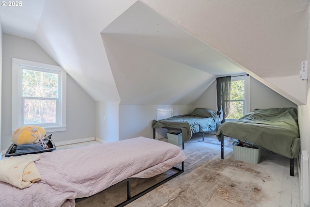 bedroom featuring lofted ceiling