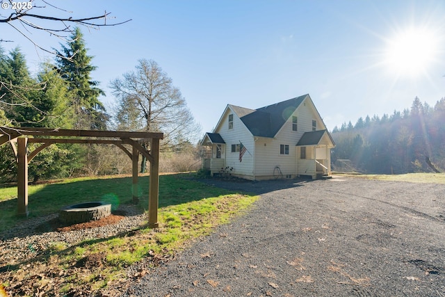 view of property exterior featuring a lawn