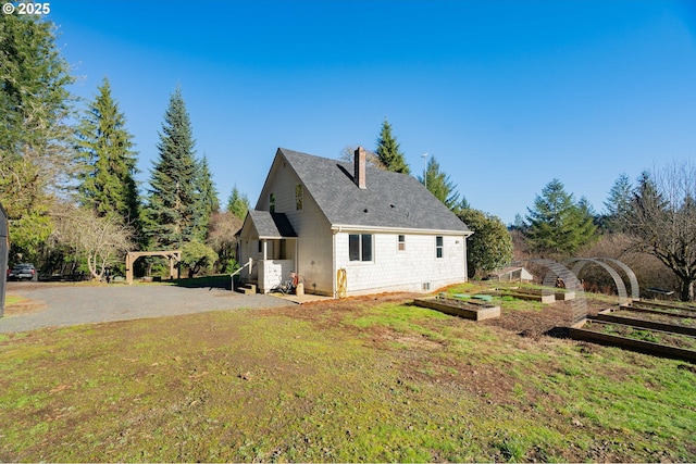 view of property exterior featuring a yard