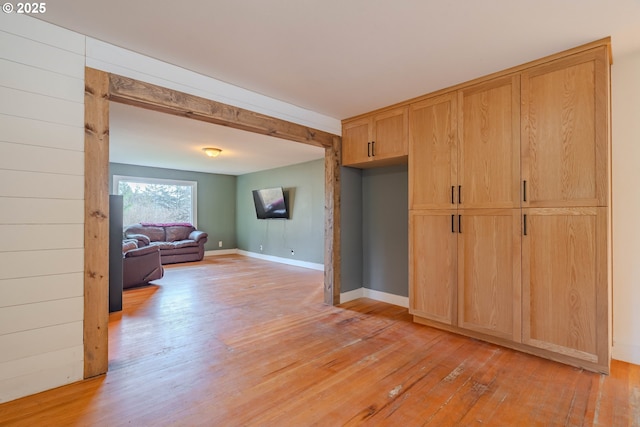 interior space featuring light hardwood / wood-style flooring and light brown cabinetry