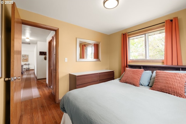 bedroom featuring wood finished floors