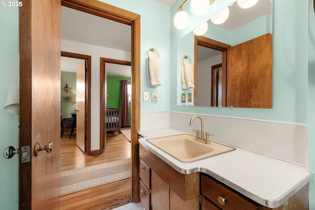 bathroom featuring wood finished floors and vanity
