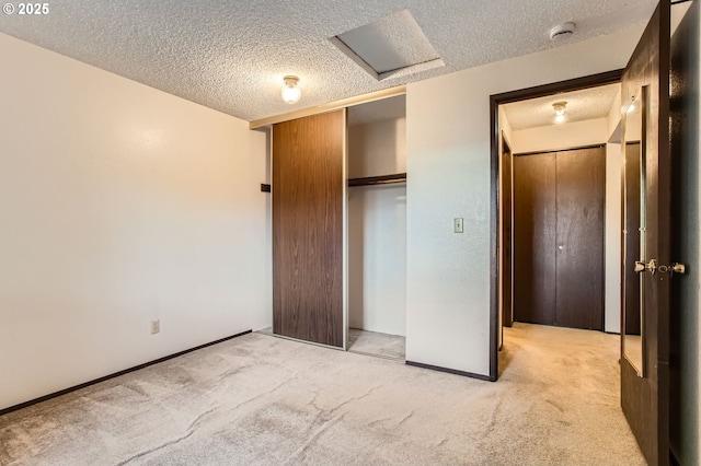 12632 NW Barnes Rd Unit 7, Portland, OR 97229 - unfurnished bedroom with a textured ceiling, carpet floors, and a closet