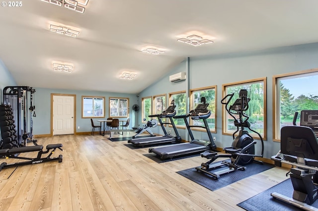 12632 NW Barnes Rd Unit 7, Portland, OR 97229 - exercise room featuring a wall mounted air conditioner, wood finished floors, and vaulted ceiling
