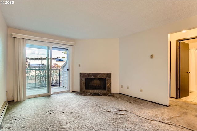12632 NW Barnes Rd Unit 7, Portland, OR 97229 - unfurnished living room featuring carpet floors, a premium fireplace, and a baseboard heating unit