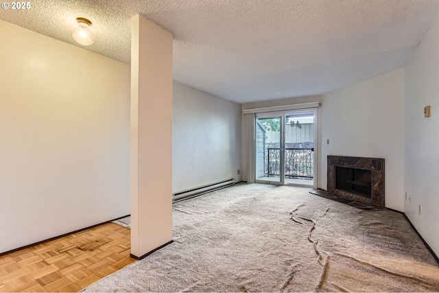 12632 NW Barnes Rd Unit 7, Portland, OR 97229 - unfurnished living room featuring a baseboard heating unit, a premium fireplace, a textured ceiling, and carpet