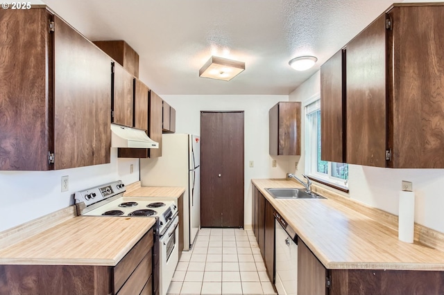 12632 NW Barnes Rd Unit 7, Portland, OR 97229 - kitchen with electric stove, custom exhaust hood, light countertops, dishwasher, and light tile patterned flooring