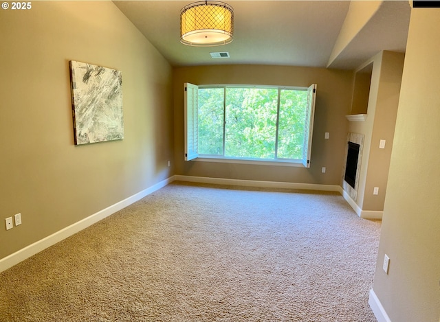 2107 NW Village Cir, Portland, OR 97229 - carpeted spare room with lofted ceiling, baseboards, and a fireplace
