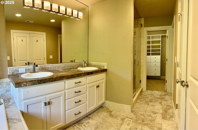 2107 NW Village Cir, Portland, OR 97229 - bathroom with a shower stall, double vanity, and a spacious closet