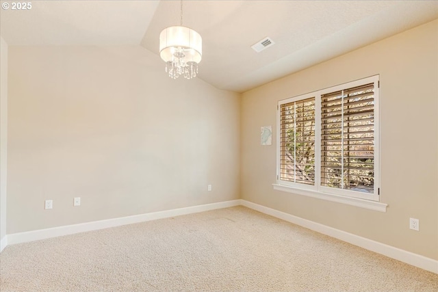 2107 NW Village Cir, Portland, OR 97229 - carpeted spare room with vaulted ceiling, a chandelier, and baseboards
