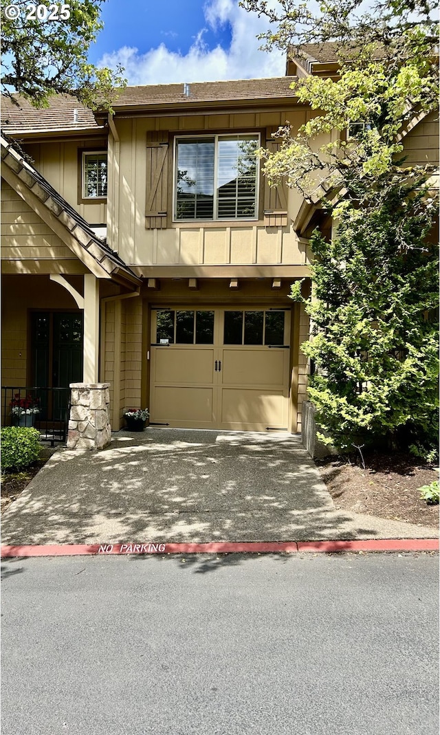 2107 NW Village Cir, Portland, OR 97229 - view of front of property featuring a garage, driveway, and roof with shingles