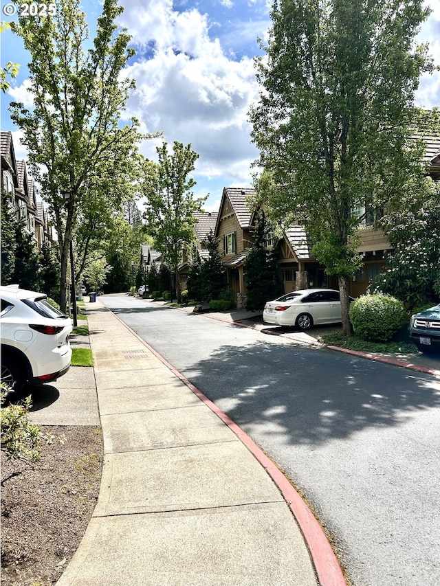 2107 NW Village Cir, Portland, OR 97229 - view of street with sidewalks, a residential view, and curbs