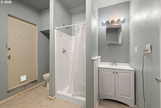 bathroom with vanity, toilet, and a shower with shower curtain