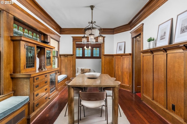 2517 NE 21st Ave, Portland, OR 97212 - dining room with ornamental molding, wainscoting, a chandelier, and dark wood finished floors