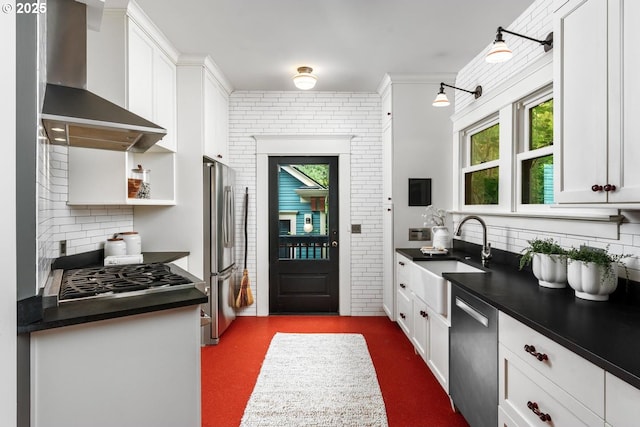 2517 NE 21st Ave, Portland, OR 97212 - kitchen featuring wall chimney exhaust hood, appliances with stainless steel finishes, dark countertops, and tasteful backsplash