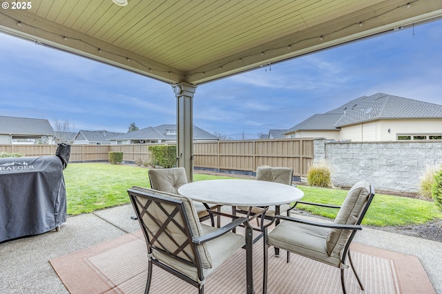 view of patio / terrace featuring outdoor dining area, a fenced backyard, and a grill