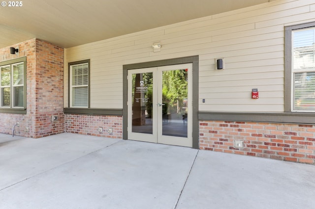 17182 SW Appledale Rd Unit 302, Beaverton, OR 97007 - entrance to property featuring french doors, a patio, and brick siding