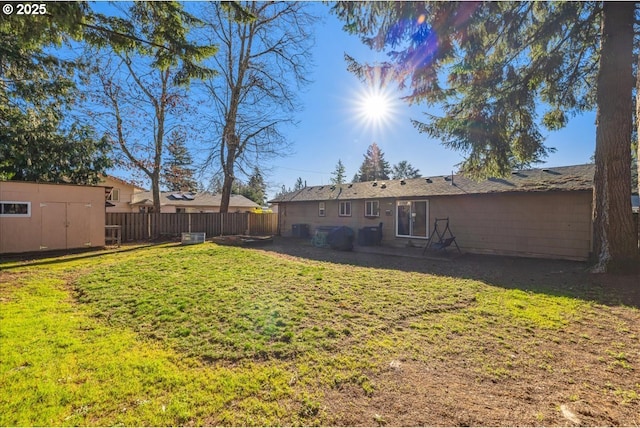 view of yard featuring a shed and a patio