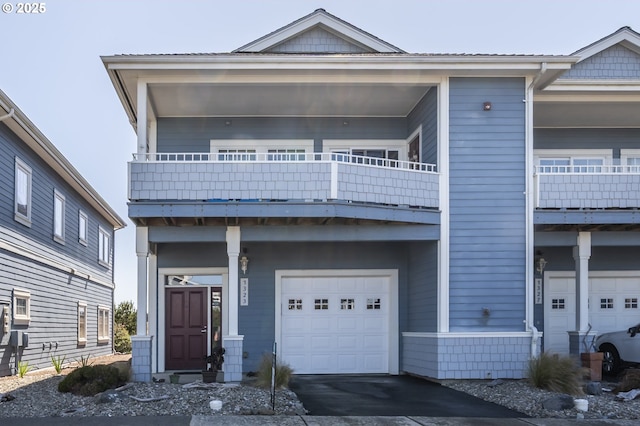 1323 Village Loop, Bandon, OR 97411 - view of front of house with a garage, a balcony, and driveway