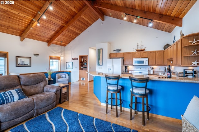 1323 Village Loop, Bandon, OR 97411 - kitchen with white appliances, rail lighting, open shelves, a wooden ceiling with exposed beams, and open floor plan