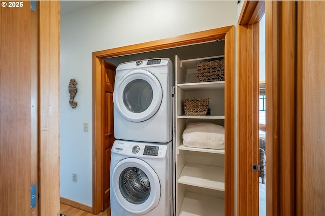 1323 Village Loop, Bandon, OR 97411 - laundry room with stacked washer / drying machine and wood finished floors