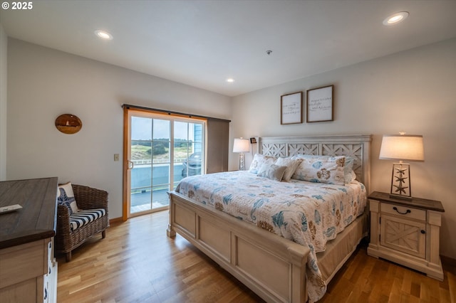 1323 Village Loop, Bandon, OR 97411 - bedroom featuring access to exterior, light wood finished floors, and recessed lighting