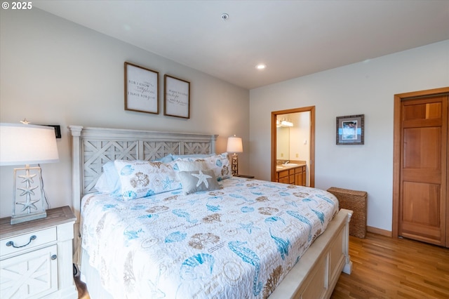 1323 Village Loop, Bandon, OR 97411 - bedroom featuring light wood-style floors, recessed lighting, and ensuite bathroom