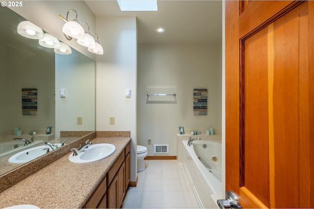 1323 Village Loop, Bandon, OR 97411 - bathroom with double vanity, a skylight, tile patterned flooring, a whirlpool tub, and recessed lighting