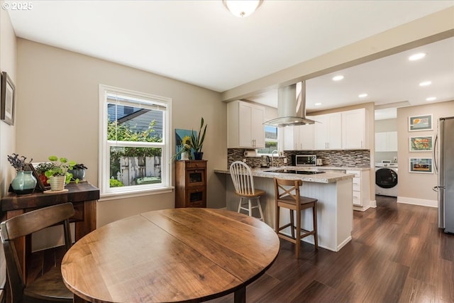 2185 Laurel Ave, Salem, OR 97301 - dining room featuring washer / dryer, dark wood finished floors, recessed lighting, and baseboards