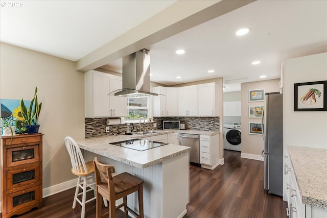 2185 Laurel Ave, Salem, OR 97301 - kitchen featuring stainless steel appliances, island exhaust hood, a peninsula, washer / clothes dryer, and a sink