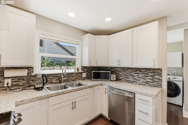 2185 Laurel Ave, Salem, OR 97301 - kitchen with washer / dryer, stainless steel appliances, a sink, light countertops, and backsplash