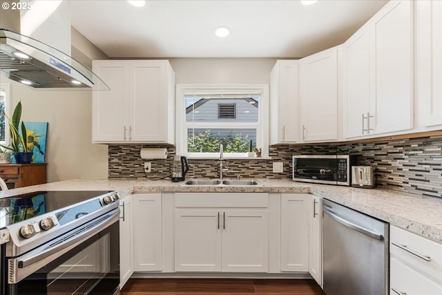 2185 Laurel Ave, Salem, OR 97301 - kitchen with appliances with stainless steel finishes, island range hood, a sink, white cabinets, and recessed lighting