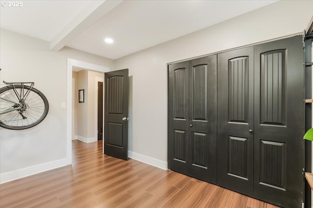 2185 Laurel Ave, Salem, OR 97301 - unfurnished bedroom featuring light wood-style floors, baseboards, beam ceiling, recessed lighting, and a closet