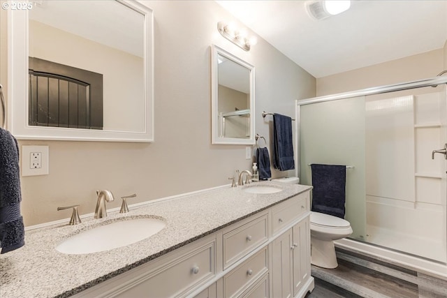 2185 Laurel Ave, Salem, OR 97301 - bathroom featuring toilet, a stall shower, double vanity, and wood finished floors