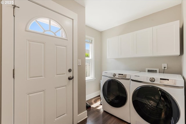 2185 Laurel Ave, Salem, OR 97301 - laundry room featuring cabinet space, washing machine and clothes dryer, baseboards, and dark wood-type flooring