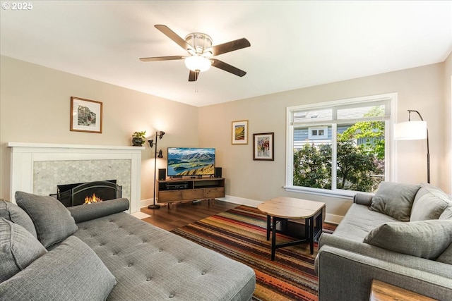 2185 Laurel Ave, Salem, OR 97301 - living area with dark wood-style floors, ceiling fan, baseboards, and a tile fireplace