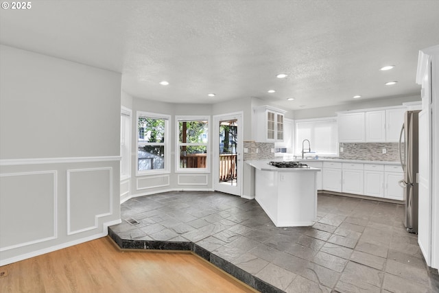 19915 SW Celebrity St, Beaverton, OR 97078 - kitchen with decorative backsplash, a sink, recessed lighting, and appliances with stainless steel finishes