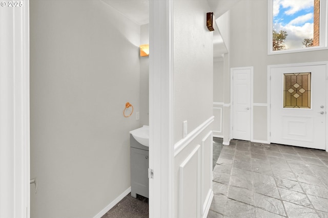 19915 SW Celebrity St, Beaverton, OR 97078 - bathroom featuring baseboards, stone tile flooring, and vanity