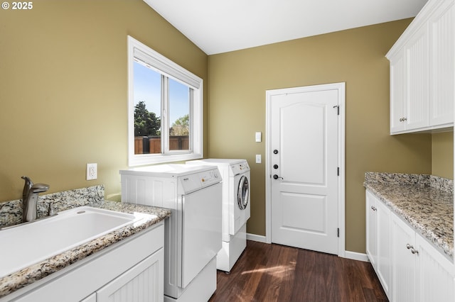 2053 Lakeview Dr, Eugene, OR 97408 - washroom featuring washer and clothes dryer, cabinet space, and dark wood-style flooring