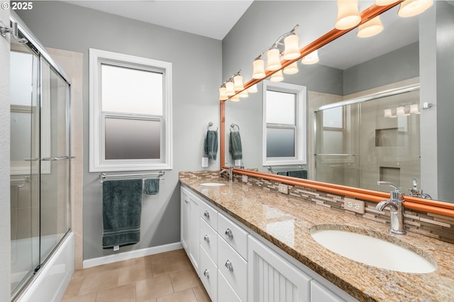 2053 Lakeview Dr, Eugene, OR 97408 - full bathroom with tile patterned floors, double vanity, bath / shower combo with glass door, and decorative backsplash