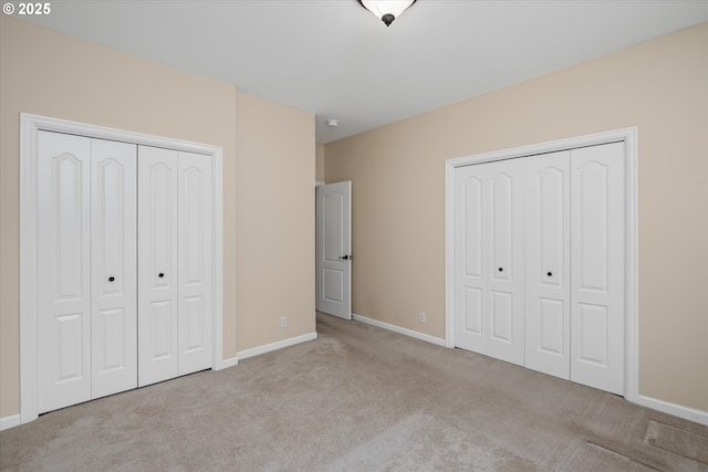 2053 Lakeview Dr, Eugene, OR 97408 - unfurnished bedroom featuring carpet flooring and two closets