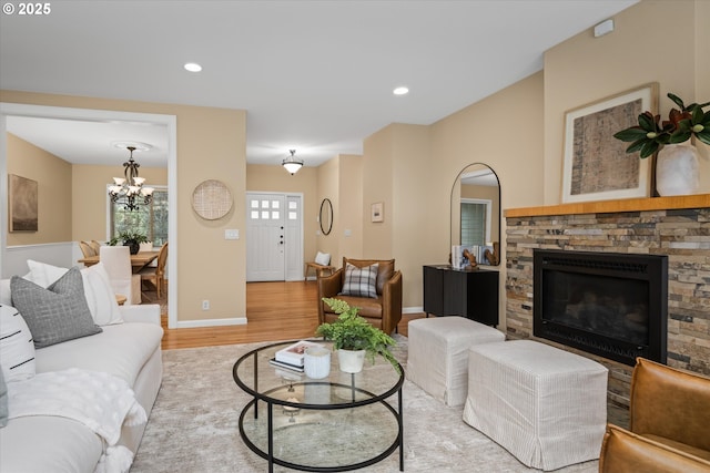 2053 Lakeview Dr, Eugene, OR 97408 - living area with light wood-style floors, a chandelier, a stone fireplace, and recessed lighting