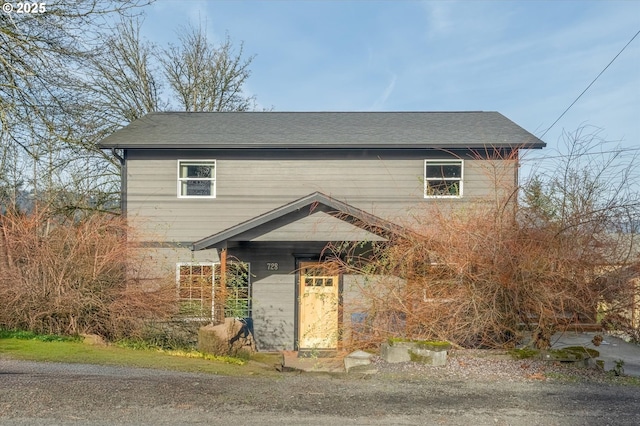 view of front of property with roof with shingles