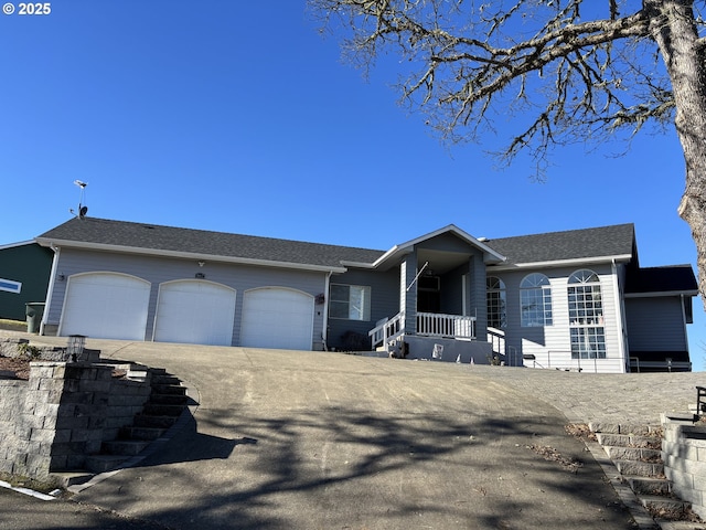 view of front facade featuring a porch and a garage