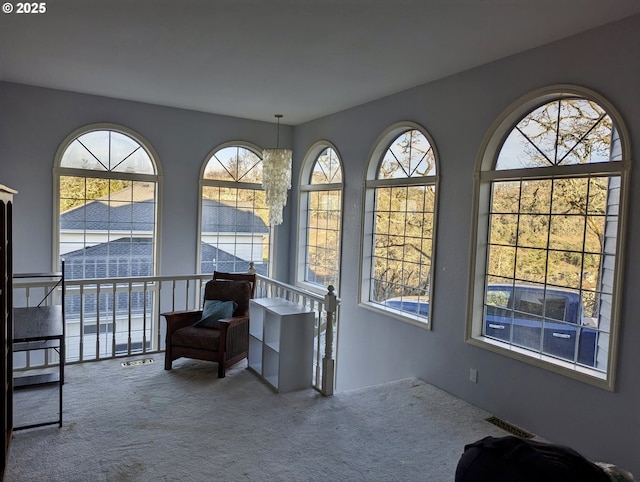 sitting room with carpet floors